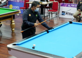 Pebiliar Sumbar Edo Fernando saat bertanding pada nomor bola 10 double PON XX 2021 Papua (ist)