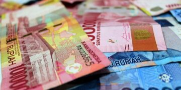 IHSG Melenggang di Zona Hijau, Rupiah Ditutup Melemah